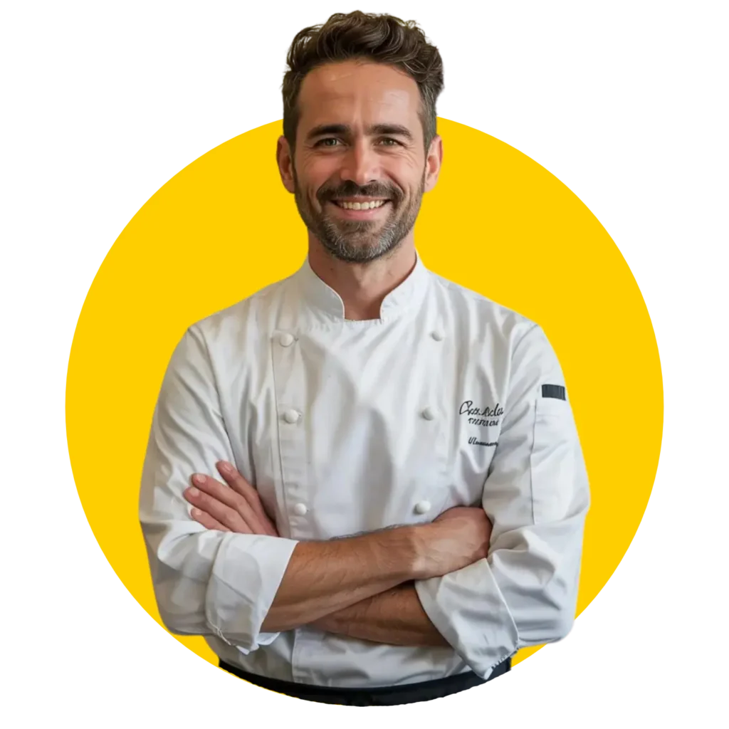 Professional chef in white coat smiling confidently